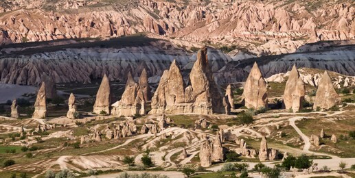 panorama of amazing sandstone formations in cappadocia, turkey. view of the valley near goreme at sunset.