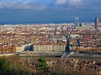aerial view of a cityscape of downtown lyon in france with plenty of red roofs and white old buildings