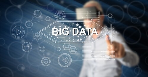 man with vr headset touching a big data concept on a touch screen with his finger