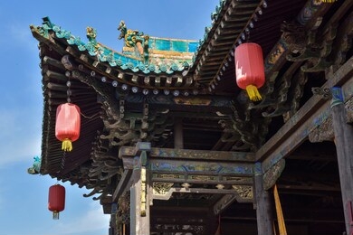 ancient chinese architectural gateway wall under clear sky and white cloud, pingyao county, jinzhong city, shanxi province, china