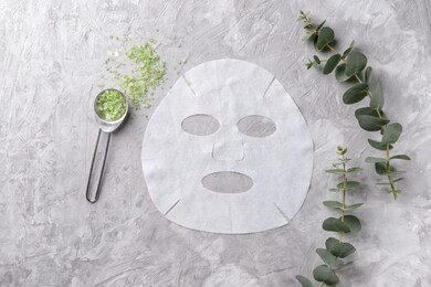 sheet facial mask with sea salt on grey background