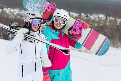 happy friends in trendy sportswears are walking and having fun at ski resort in warm winter weather, close up photo. free and spare time