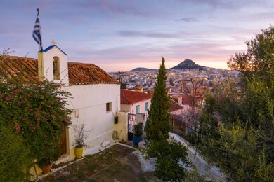 view of lycabettus hill from anafiotika neighborhood in the old town of athens, greece. 