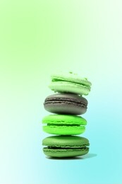 colorful neon green macaroons stacked on top of each other. macaroons on bright colored background. tasty colorful french macaroon pyramid. abstract surrealism and minimalism