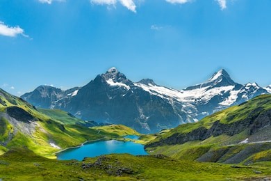 bach alp lake in the near of grindelwald switzerland. surrounded by mountains