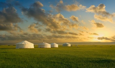 sunset on a yurt , in the grassland of mongolia	