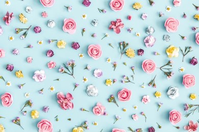 flowers composition. pattern made of colorful flowers on pastel blue background. spring, easter, summer concept. flat lay, top view