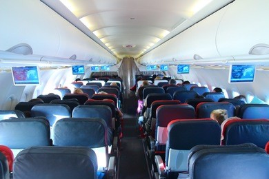 airplane interior - people sitting on seats