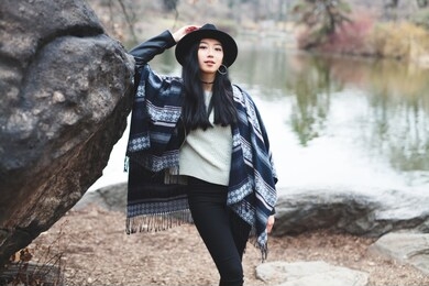 asian girl hanging out by the lake