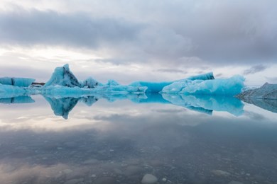 glacier ice reflections in jokulsarlon lagoon, iceland