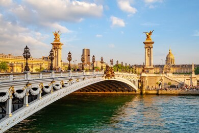 the alexander iii bridge across seine river in paris, france at sunset