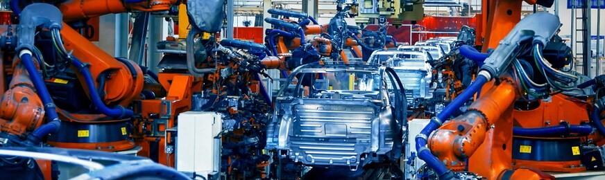 automated robotic arm on the car production line is welding the car body