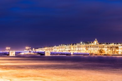 beautiful palace bridge on neva river in saint petersburg in russia between palace square and vasilievsky island in winter time. view on the winter palace