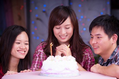 young asian friends at birthday party