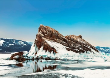 view of rock elenka on a sunny winter day. lake baikal, olkhon island. eastern siberia, russia