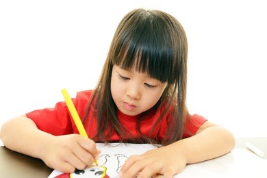 little girl studying at the desk