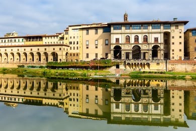 florence, italy view with uffizi gallery facade and reflection in the river arno, tuscany