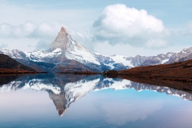 amazing colorful sunrise on stellisee lake. snowy matterhorn cervino peak with reflection in clear water. zermatt, swiss alps, switzerland. landscape photography