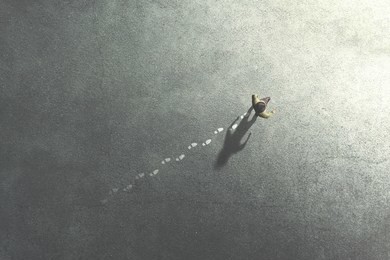 man walking in the streets leaving footsteps on the ground, past concept