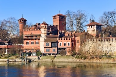 medieval fortress in valentino park, turin, piedmont, italy, bright blue sky spring morning on the po river