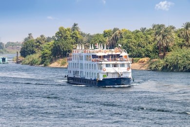  a tourist boat motor down the river nile towards aswan in central egypt. the tourist boats cruise between luxor and aswan in upper egypt