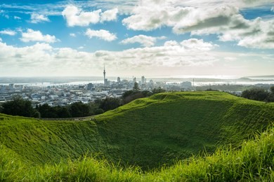 skyline of auckland city seen from the now resting volcano mount eden in a charm autumn morning. 