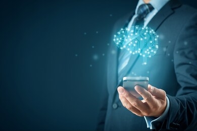 artificial intelligence (ai), machine deep learning, data mining, and another modern computer technologies concepts. brain with pcb design representing ai and businessman holding smart mobile phone.