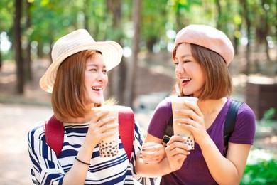 happy girls drinking bubble tea and enjoy summer vacation 
