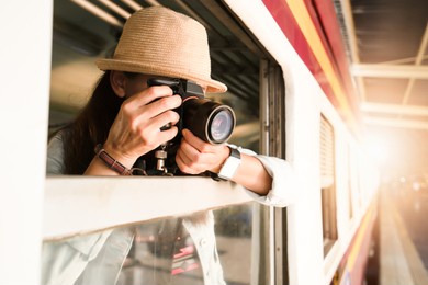 woman photographer traveling by train