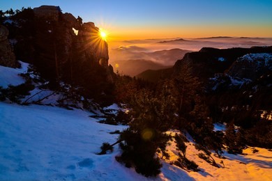 aerial landscape view from ceahlău mountains national park at sunset in winter season,sunset in ceahlau mountains