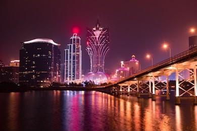 macao cityscape skyline with governador nobre de carvalho bridge at night in china.