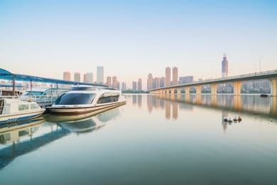 wuhan yangtze river bridge and modern architecture and yacht wharf in china
