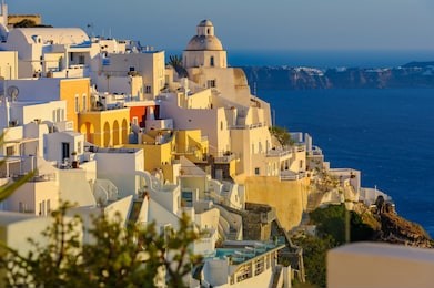 typical view of fira village patios at sunset, santorini island, greece