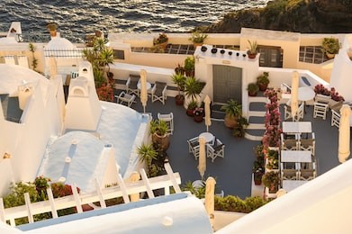 typical view of fira village patios at sunset, santorini island, greece