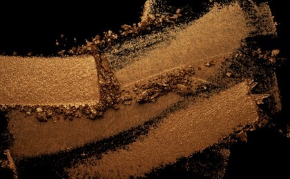 eye shadow metallic brown terracota gold texture background black isolated 