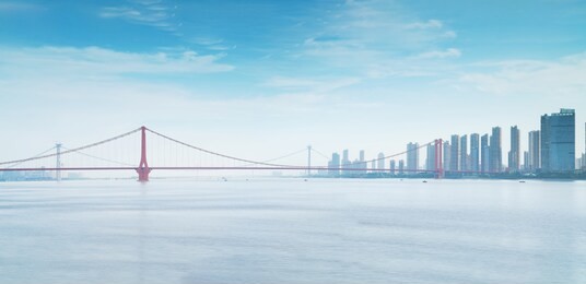 yangtze river bridge and modern architecture in wuhan, china
