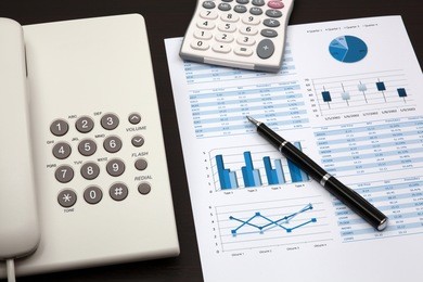 business report with telephone on a table