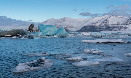 panoramic view of the glacier lagoon joekulsarlon with icebergs and in the background the glacier, winter in iceland, europe