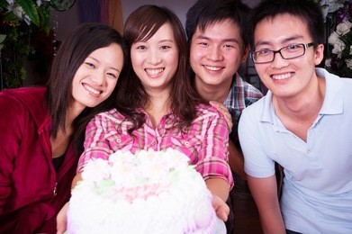 young asian friends at birthday party