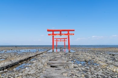 the floating torii gate of ouo shrine in ariake sea, tara town, saga prefecture, japan. (translated text: the god of the sea) 