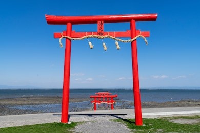 the floating torii gate of ouo shrine in ariake sea, tara town, saga prefecture, japan. (translated text: the god of the sea) 