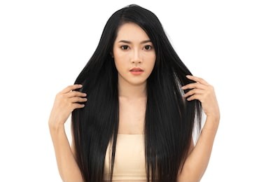 beautiful woman beauty health care with black long shiny straight smooth hair isolated on white background.hair cosmetics 