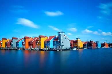colorful buildings at reitdiephaven on water in groningen, netherlands