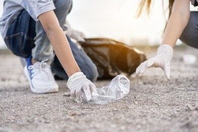 group of kids school volunteer charity environment, improving environment. kind eco-friendly volunteers holding packets and gathering garbage 