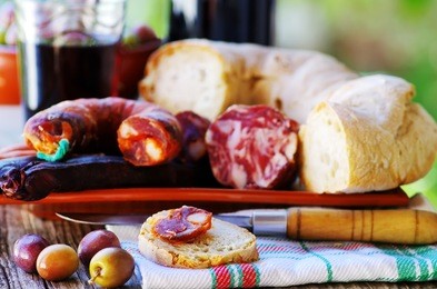 bread, meat, olives and portuguese wine