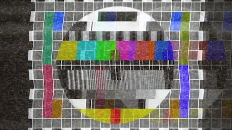 an analogue old crt tv test card with color bars, full of noise, static, grain, ghosting artifacts.
