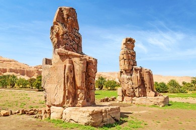 the colossi of memnon, two massive stone statues of pharaoh amenhotep iii in luxor, egypt