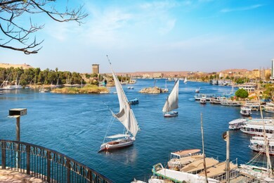 river nile and boats at sunset in aswan
