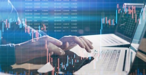 analyst using laptop and researching the financial data at his office. concept of a digital diagram, graph interface, virtual screen, technical price indicator, trading online, global market