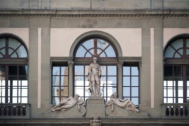 uffizi gallery in florence, italy. detail of window and statue.